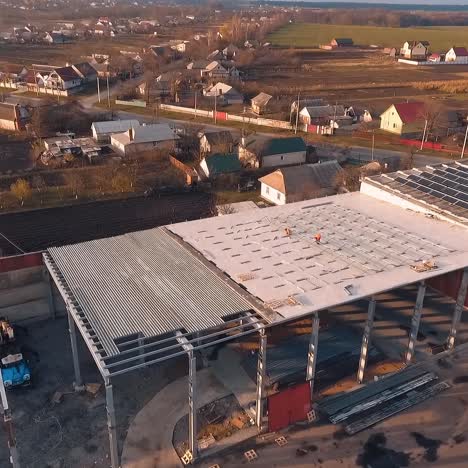 workers on roof installing solar panels