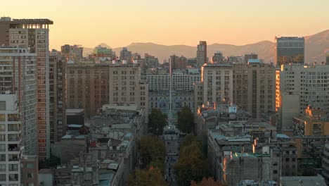 la moneda palace in santiago, chile, glows in warm golden sunlight during a clear day