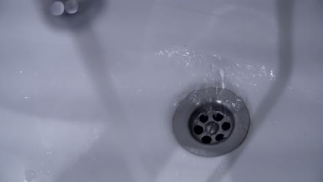 water draining into sink
