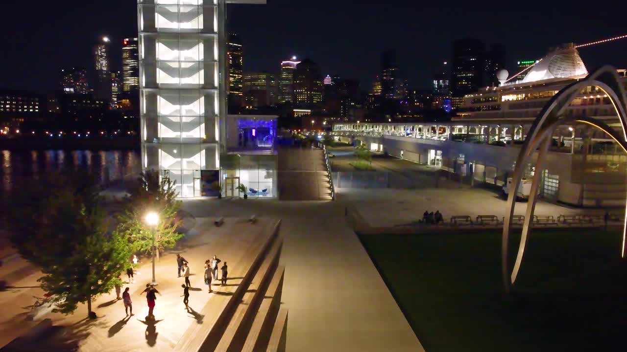 Nightlife in Montréal, a seaport in the background. Aerial view.