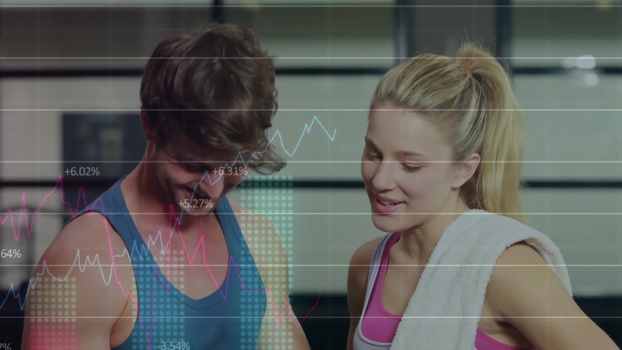 Man inputting workout data on tablet tracking metrics, woman joining while charts overlaying scene