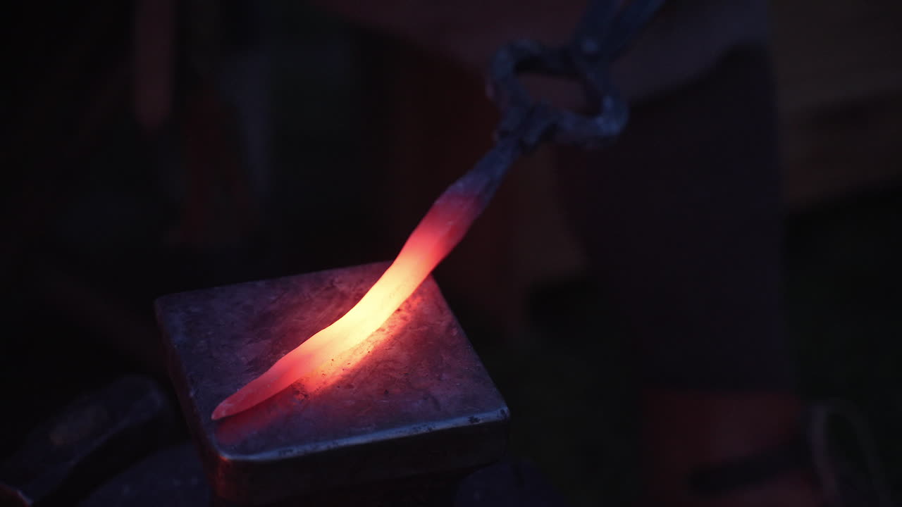 Blacksmith at work, shaping hot metal