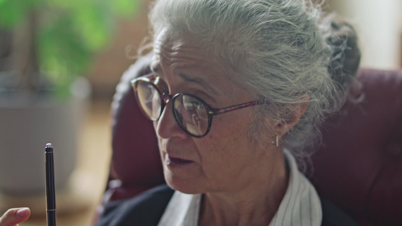 Senior Female Psychologist Giving Mental Health Consultation to Patient
