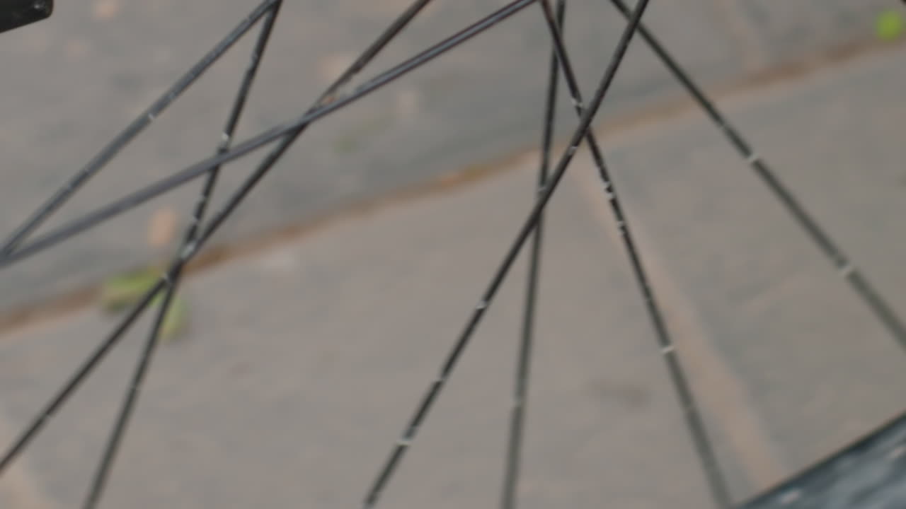 Wheelchair Hub Closeup Dirty Spokes Grime, Tight Mechanical Shot Showing Axle And Bearing With Grease And Rust, Workshop Repair Vibe With Focus On Fasteners And Wear, Inspection And Maintenance
