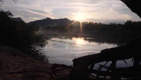 Kayaks-pass-through-the-sun-reflecting-on-the-waters-at-the-salt-river