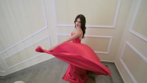 woman in a red satin ball gown