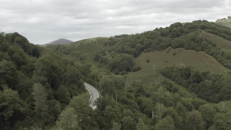 panoramic mountain road crossing roncesvalles or ronceval or roncevaux pass, pyrenees, spain