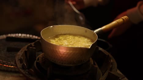 cooking soup on a gas stove in a kitchen