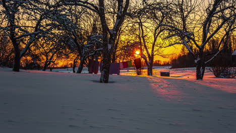 Sunrise-early-morning-time-lapse-in-snowy-winter-rural-area-of-Riga,-Latvia