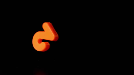 Orange-number-two-falling-on-black-background