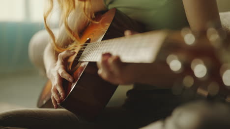 woman playing acoustic guitar