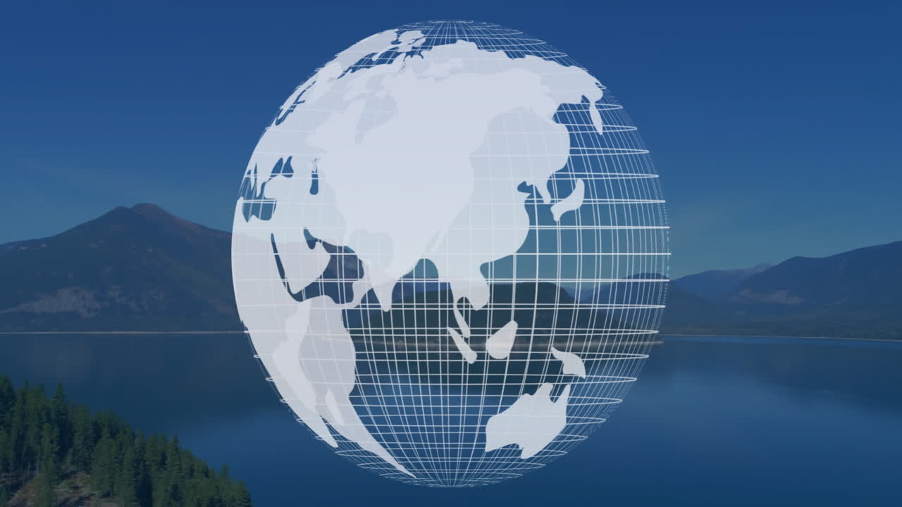 Digital wireframe globe showing Asia and Australia floating over mountain lake reflecting sky