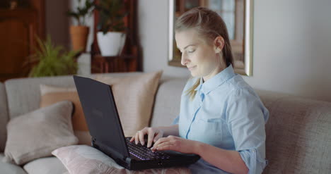 smiling woman working on laptop at home office businesswoman typing on computer keyboard 13