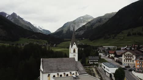 alpine village with church