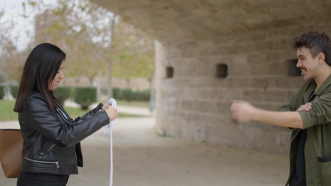 Magician Performing a Rope Trick in a Park