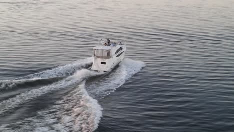 traces of foamy waves behind a cruising luxury private yacht during summer