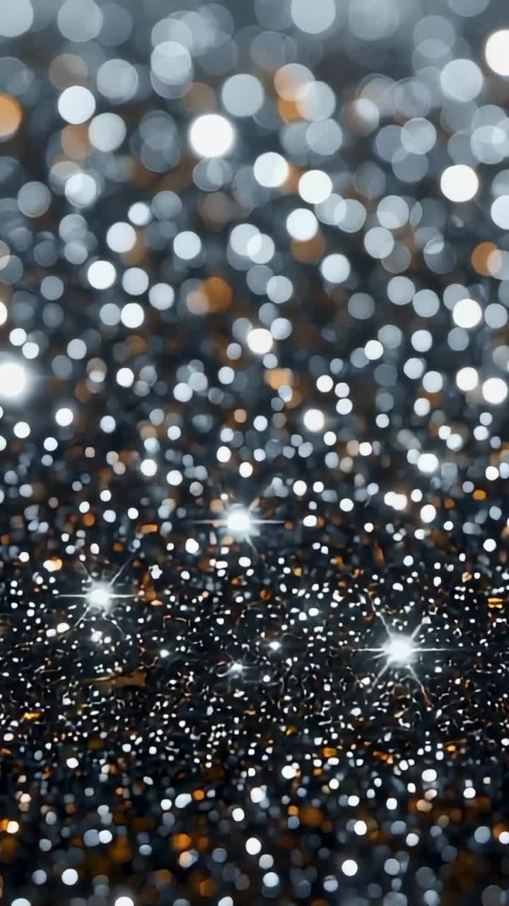 Vertical video: Showing glitter shining on shiny surface, with bokeh circles and sparkling points