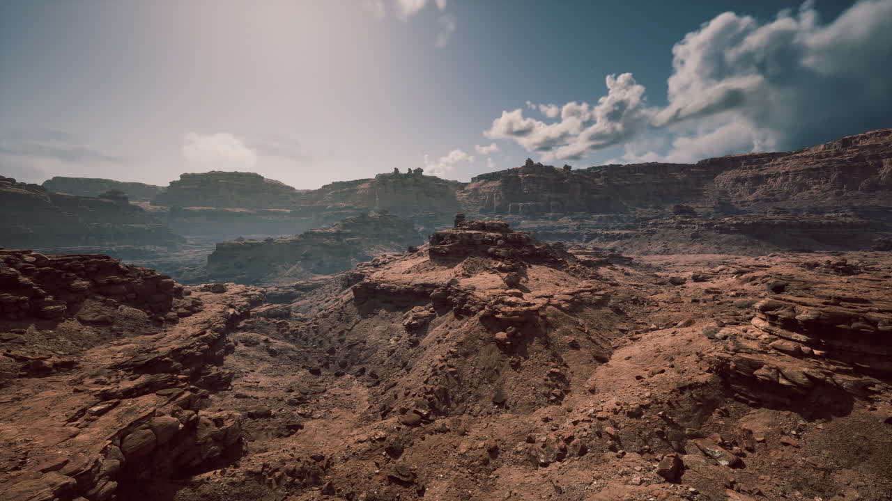Stunning rocky landscape with distant cliffs and dramatic cloud formations