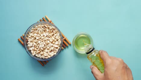 peanuts and oils in a container ,