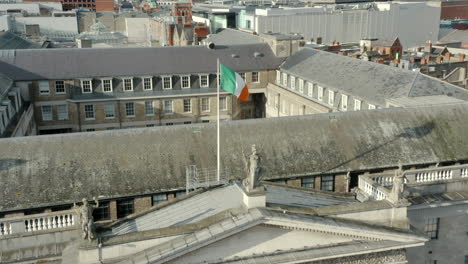 aerial close up of the irish flag located on top of the gpo located in dublin city