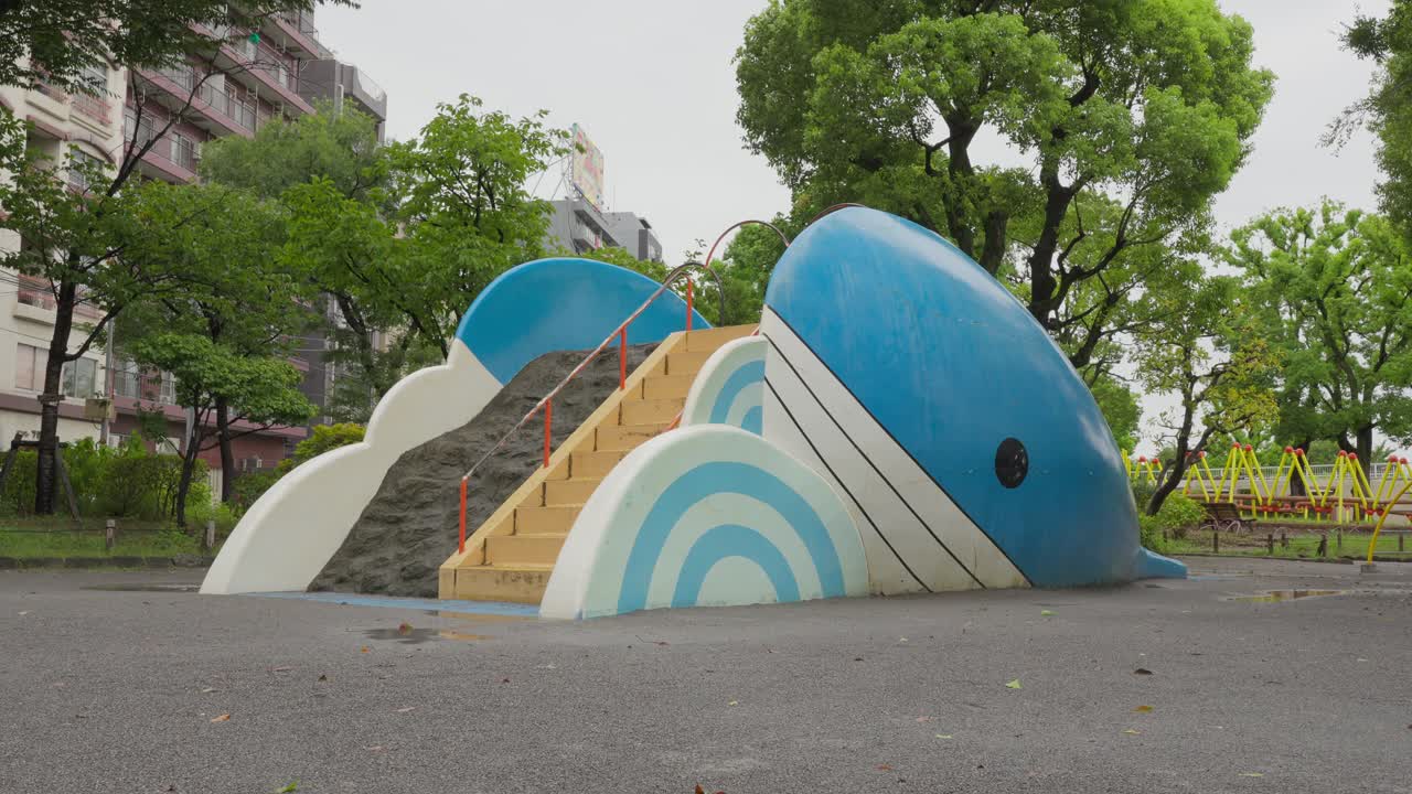 A cute whale-shaped slide in a park in Chuo City, Tokyo. Cloudy day