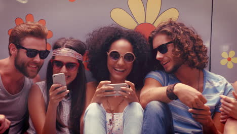 in high quality format hipster friends using their phones