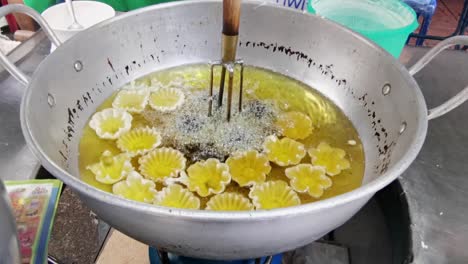 kratong thong thai dessert fried and served at chinatown in bangkok street food market