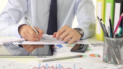 businessman working on documents and charts
