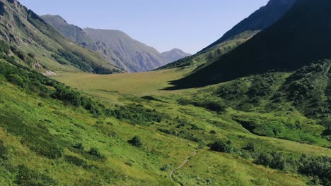 View-from-the-high-track-in-caucasus-mountains-glaciers,-green-grass,-wild-lakes