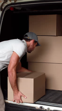 delivery driver loading his van