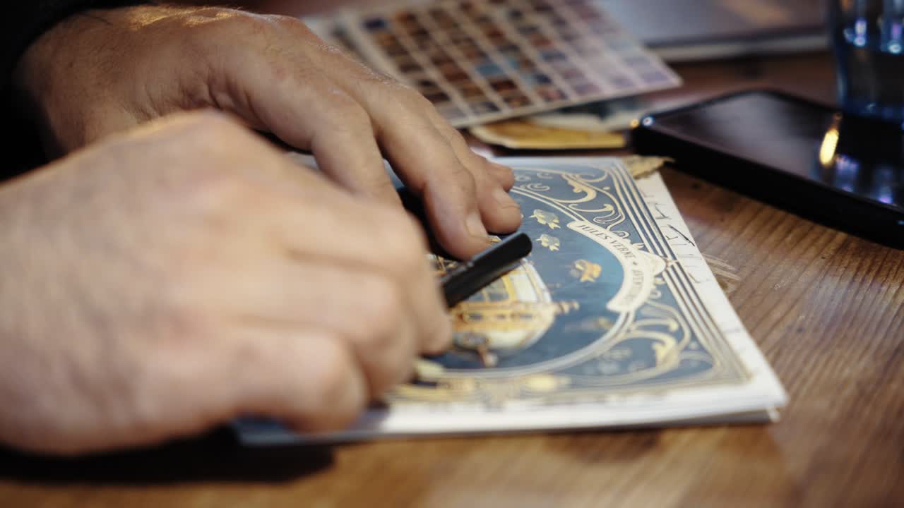 Close-up of hand sketching in a notebook, white pages, symbolizing creativity and artistic expression, capturing the essence of imagination and design