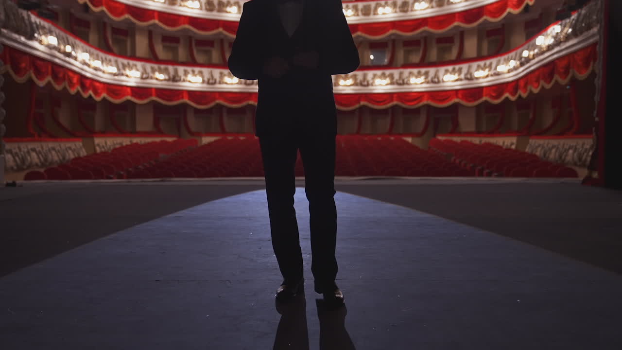 Actor in empty theater. Lonely actor on stage in theater