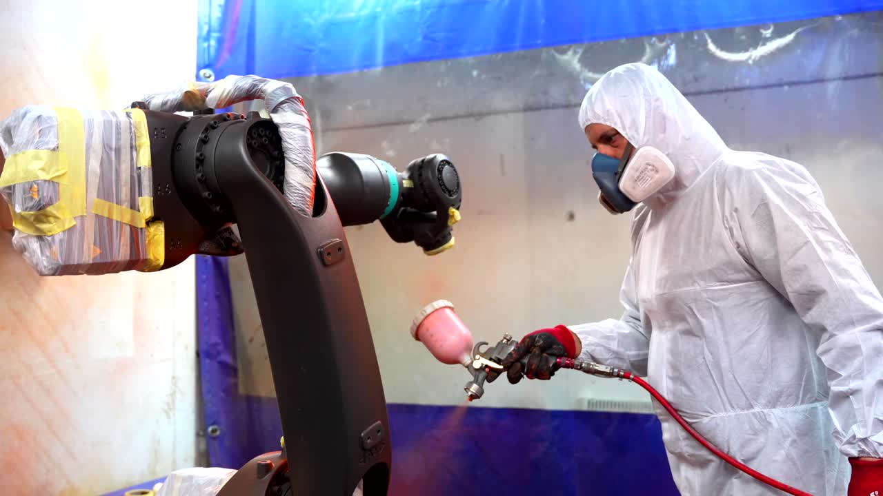 Spray painting process with industrial robot and protective suit