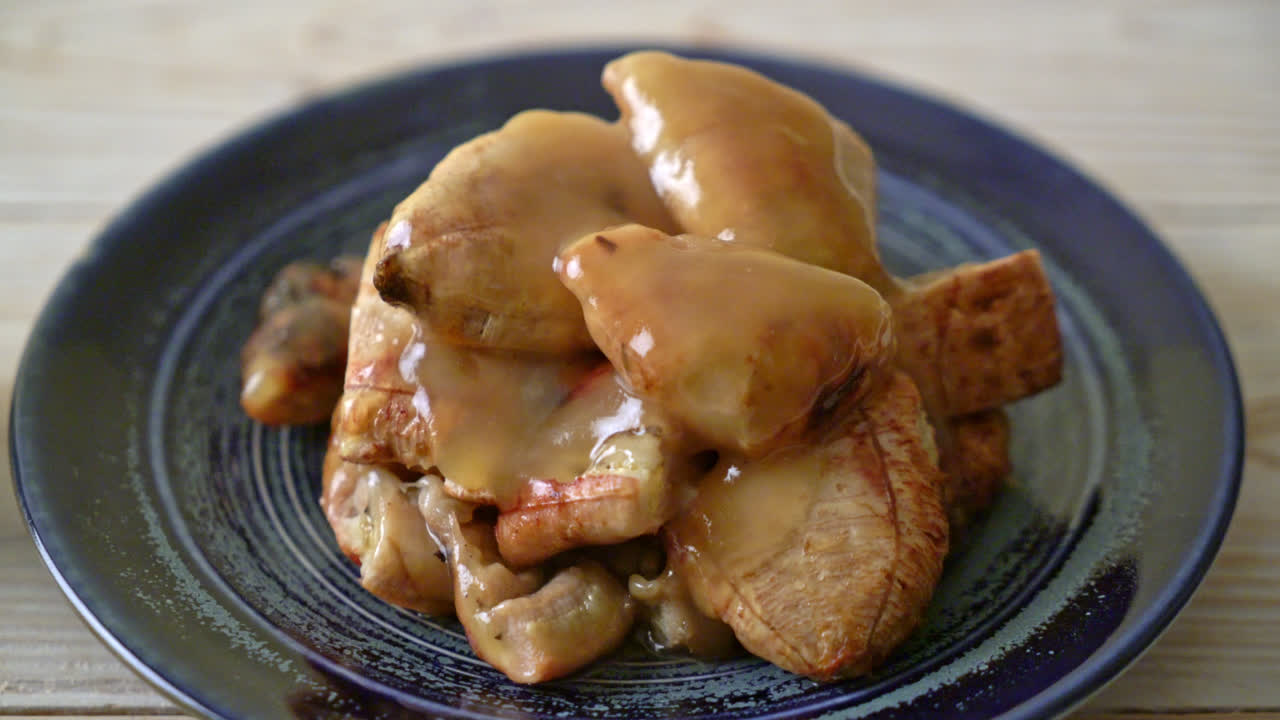 grilled bananas with coconut caramel sauce on plate