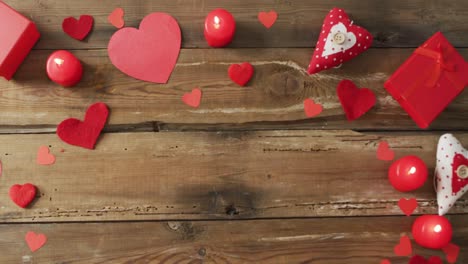 Paper-hearts-and-candles-on-wooden-background-at-valentine's-day