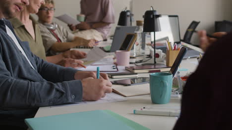 people working together at desks in a modern office