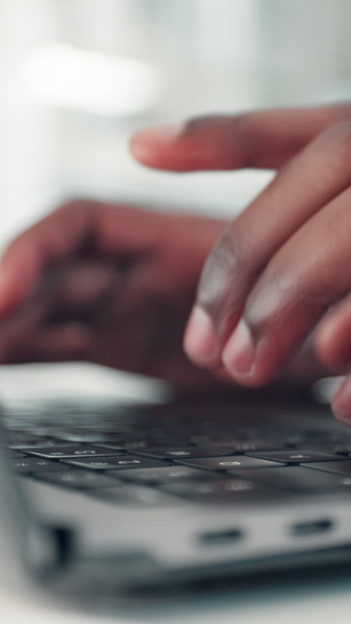 Close-Up of Hands Typing on a Laptop Keyboard