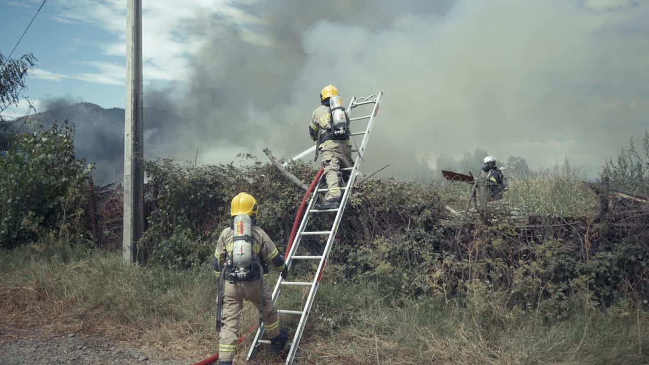 firefighters in action on a farm in flames in Chile