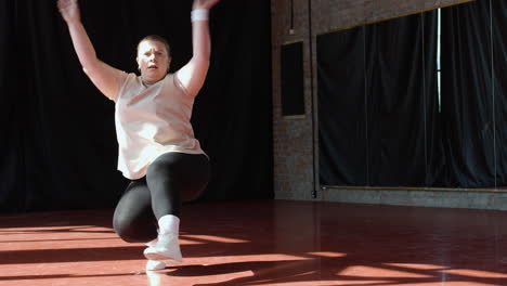 woman dancing indoors