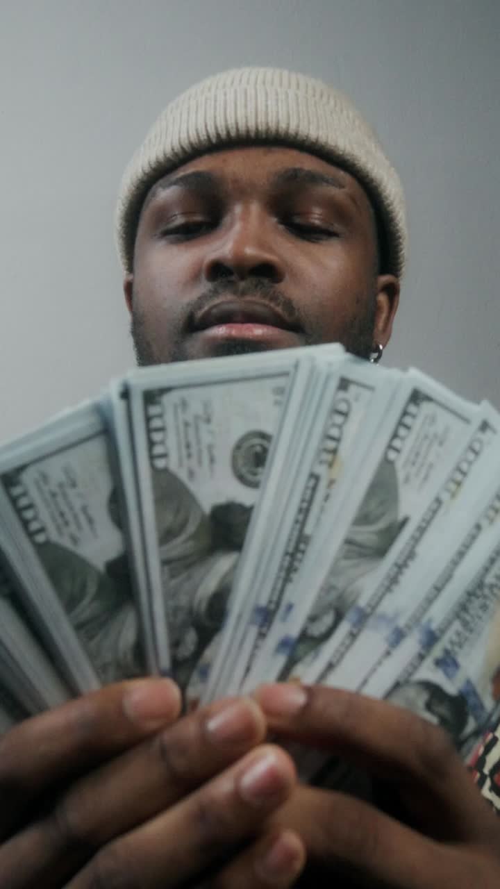 Man Holding Stacks of Money