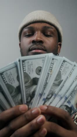 man holding stacks of money