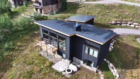 large modern contemporary luxury home in silverthorne colorado aerial trucking pan