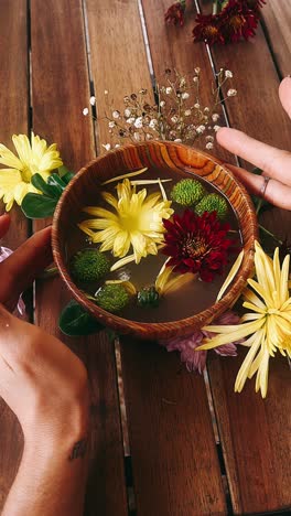 floral arrangement in wooden bowl