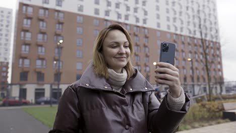 woman taking selfie outdoors