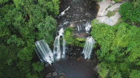 waterfall in lush green jungle of cambodia