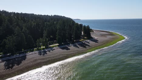 bonniebrook beach on a cloudless sunny morning during summer in gibsons, british columbia