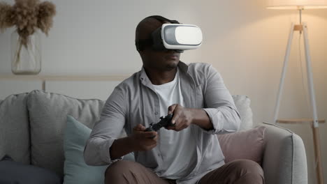 man playing vr game on couch