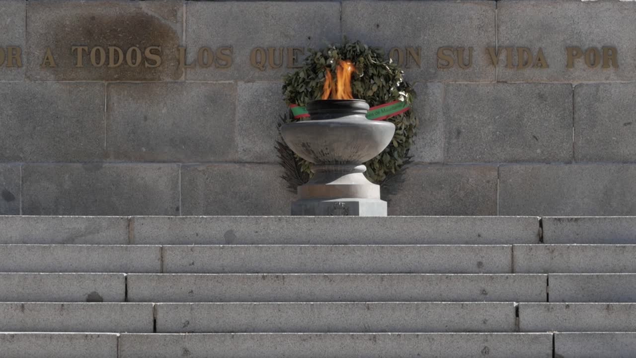 Eternal flame at war memorial, honoring fallen heroes in central Madrid, Spain