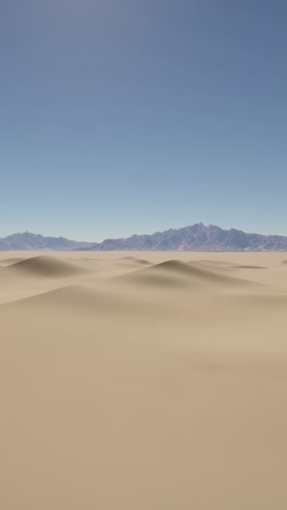 stunning desert landscape with rolling sand dunes and distant mountains