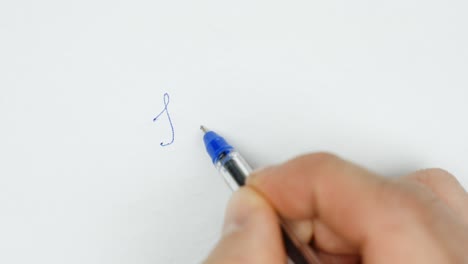 a close-up of a hand using a blue pencil to write "i love you" on white paper, capturing a heartfelt moment of expression.